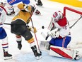 Montreal Canadiens goaltender Sam Montembeault (35) makes a save against Vegas Golden Knights left wing William Carrier (28) during the third period at T-Mobile Arena.
