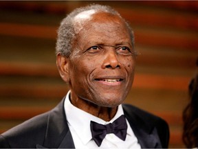 FILE PHOTO: Actor Sidney Poitier arrives at the 2014 Vanity Fair Oscars Party in West Hollywood, California March 2, 2014.