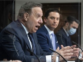 Premier François Legault and Simon Jolin-Barrette, the minister responsible for the French language, address a news conference after tabling Bill 96 on May 13, 2021 at the National Assembly in Quebec City.