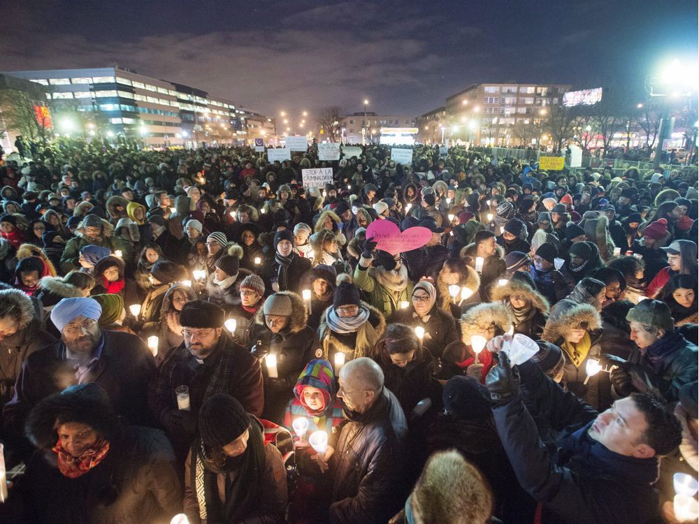 People gather at a Montreal vigil on Jan. 30, 2017 in the wake of the mosque shooting in Quebec City that killed six worshippers.
