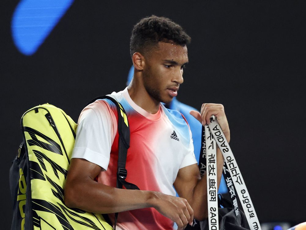 Montreal's Félix Auger-Aliassime walks off court dejected after losing his quarterfinal match against Russia's Daniil Medvedev at the Australian Open.