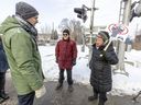 Neighbourhood residents Ronald Daignault and Chantal Laurin voice their concerns to CDPQ Infra spokesperson Jean-Vincent Lacroix, left, after a media briefing on the REM de l'Est in Montreal on Tuesday January 25, 2022.