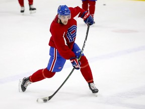 Defenceman Josh Brook takes a shot during Laval Rocket practice at the Place Bell Sports Complex in Laval on Jan. 30, 2020.