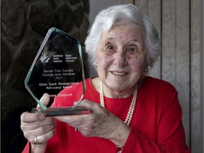 Irene Lambert with her Chris Stark Distinguished Advocacy Award at her home in Dollard-des-Ormeaux.
