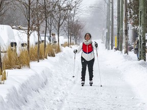 Émilie Martel skiis down the Clark St. bike path on a snowy day in Montreal's Mile End.