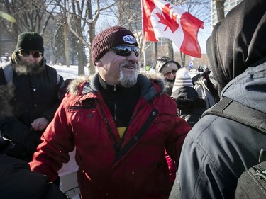 Bernard "Rambo" Gauthier, centre, one of the main organizers of protest outside Quebec's National Assembly, where a massive protest against COVID-19 vaccine and health restrictions was held on Saturday, Feb. 5, 2022.