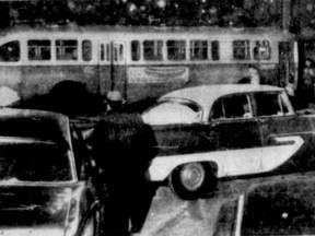 A Montreal bus was broadsided on treacherous Windsor St. above St-Antoine St. and crashed into a pole. Two cars crashed in the confusion, Feb. 8, 1960.