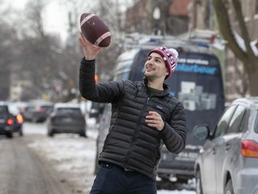 Sebastien Yeargan makes a one-hand catch while throwing a football with friend Simon Imbauch in N.D.G.