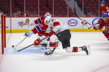 New Jersey Devils' Michael McLeod shoots the puck past Montreal Canadiens' Cayden Primeau for a goal during second period in Montreal Tuesday, Feb. 8, 2022.
