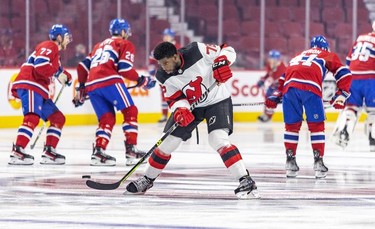 P.K. Subban of the New Jersey Devils passes a puck to a teammate during warmup prior to game against the Canadiens in Montreal on Tuesday, Feb. 8, 2022.