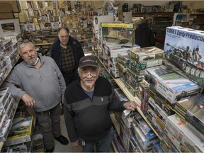 David Jenkins (from left), Paul Crepin and Anthony Chan at the Hobby Jonction Express shop in Dorval on Saturday. The store is set to close after 27 years.