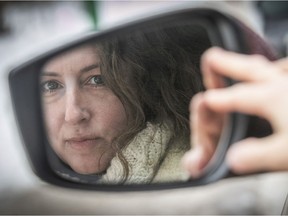 Montreal filmmaker Vanya Rose looks in the rearview mirror of a car.  Her new feature Woman in Car is out this month.