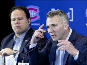 Canadiens interim head coach Martin St. Louis speaks to the media on Thursday as vice-president of hockey operations Jeff Gorton looks on.