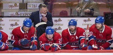 Montreal Canadiens interim head coach Martin St. Louis encourages his players, from left, Jake Evans, Cole Caufield, Paul Byron and Joel Armia on the bench during the first period against the Washington Capitals in Montreal Thursday, Feb. 10, 2022.