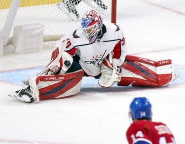 Washington Capitals' Ilya Samsonov makes a splits save on shot by Montreal Canadiens' Nick Suzuki during third period in Montreal Thursday. Feb. 10, 2022.