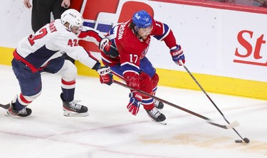 Montreal Canadiens' Josh Anderson holds off Washington Capitals' Martin Fehervary during third period in Montreal Thursday, Feb. 10, 2022.