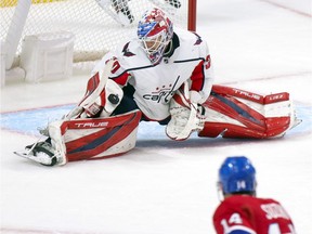 Capitals' Ilya Samsonov makes a save on Canadiens' Nick Suzuki during the third period Thursday night at the Bell Centre.