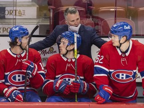 Montreal Canadiens interim head coach Martin St. Louis has a conversation with Josh Anderson, left, Rem Pitlick and Artturi Lehkonen during third period against the Washington Capitals in Montreal on Feb. 10, 2022.