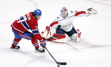 Montreal Canadiens' Josh Anderson has the puck poked away from him by Washington Capitals' Ilya Samsonov during second period in Montreal Thursday, Feb. 10, 2022