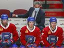 Laval Rocket head coach Joël Bouchard behind the bench during his team's American Hockey League game against the Belleville Senators in Montreal on Feb.  12, 2021.