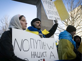 Kostia Iakymov from Ukraine and his wife Ksenia Kil participate in a rally in support of the people of Ukraine at the Roddick Gates on Thursday February 24, 2022.