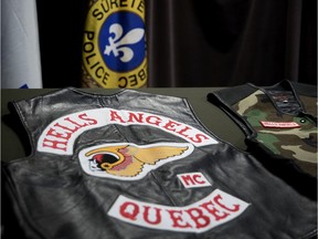 Sûreté du Québec display Hells Angels vests.