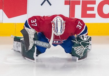 Montreal Canadiens goaltender Andrew Hammond (37) stretches prior to Habs' game against the St. Louis Blues in Montreal on Thursday, Feb. 17, 2022.