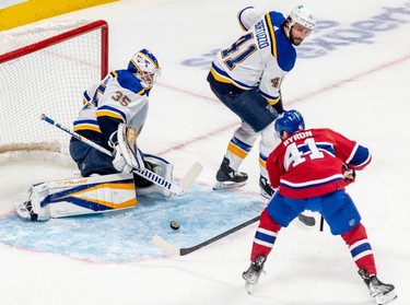 Montreal Canadiens left wing Paul Byron (41) scores against St. Louis Blues goaltender Ville Husso (35) during first period against the St. Louis Blues in Montreal on Thursday, Feb. 17, 2022.