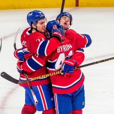 Montreal Canadiens left wing Paul Byron (41) is congratulated by teammates Jake Evans (71) and Artturi Lehkonen (62) during first period against the St. Louis Blues in Montreal on Thursday, Feb. 17, 2022.