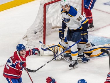 Montreal Canadiens right wing Cole Caufield (22) celebrates after scoring the tying goal against the St. Louis Blues in the dying seconds of the third period in Montreal on Thursday, Feb. 17, 2022.