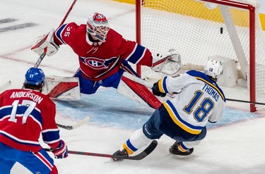 St. Louis Blues centre Robert Thomas (18) scores against Montreal Canadiens goaltender Sam Montembeault (35) during first period against the St. Louis Blues in Montreal on Thursday, Feb. 17, 2022.