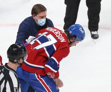 Montreal Canadiens' Josh Anderson (17) is taken away after falling to the ice after receiving flying puck to the head during second period NHL action in Montreal on Wednesday, Feb. 23, 2022.