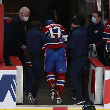 Montreal Canadiens' Josh Anderson (17) is taken away after falling to the ice after receiving flying puck to the head during second period NHL action in Montreal on Wednesday, Feb. 23, 2022.