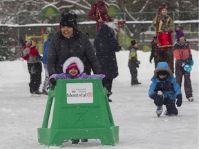 Navneet Kaur and daughter Arya have some fun on the ice while attending Plaisirs d'Hiver Saturday at Roxboro Park in the Pierrefonds-Roxboro borough.