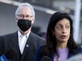 Quebec Liberal Leader Dominique Anglade speaks with the media as David Birnbaum, MNA for D'Arcy-McGee, looks on, at Dawson College in Montreal, on Feb. 24, 2022.