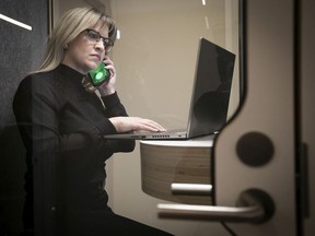 Mélanie Boivin, head of interior design at ADHOC Architectes, works in one of the new soundproof phone booths the firm recently created to allow for private phone calls and video conferences. “If there’s cacophony, people won’t want to go back,” Boivin said.