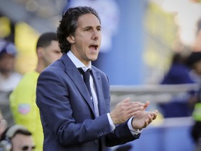 Montreal Impact head coach Mauro Biello claps for one of his players during second half against the Portland Timbers in Montreal on May 20, 2017.