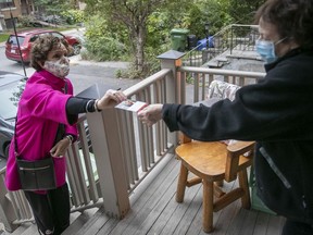 Sue Montgomery goes door to door in N.D.G. during the 2021 municipal election campaign.
