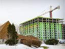 Construction of an apartment complex behind Brasserie Le Manoir at the Hymus and St-Jean boulevards in Pointe-Claire, as seen in December.