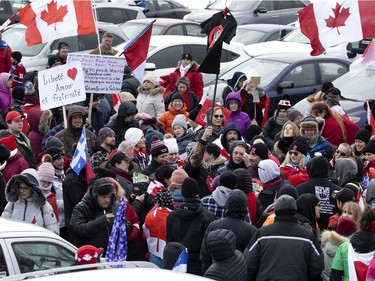 A crowd of a several thousand people gather to support the freedom convoy movement in Montreal on Saturday, Feb. 12, 2022.