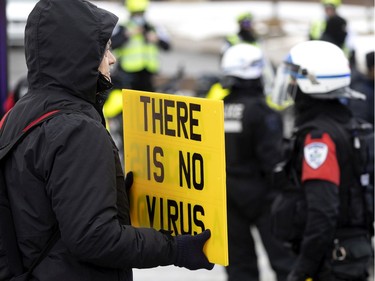 A crowd of several thousand people gather to support the Freedom Convoy movement in Montreal on Saturday, Feb. 12, 2022.