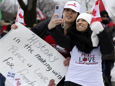 A crowd of several thousand people gather to support the Freedom Convoy movement in Montreal on Saturday, Feb. 12, 2022.