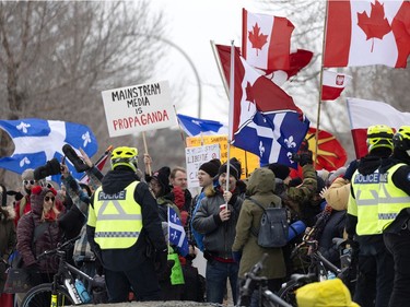 A crowd of several thousand people gather to support the Freedom Convoy movement in Montreal on Saturday, Feb. 12, 2022.