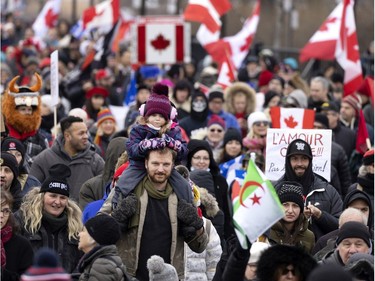 A crowd of a few thousand people gather to support the Freedom Convoy movement in Montreal on Saturday, Feb. 12, 2022.