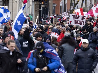 A crowd of several thousand people gather to support the Freedom Convoy movement in Montreal on Saturday, Feb. 12, 2022.