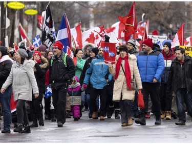 A crowd of several thousand people gather to support the Freedom Convoy movement in Montreal on Saturday, Feb. 12, 2022.