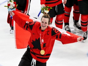 Team Canada captain Marie-Philip Poulin celebrates the team's gold medal win in women's hockey at the Beijing 2022 Winter Olympics on Feb. 17, 2022. In Beijing, clutch scorer Poulin cemented her claim to be the greatest Canadian athlete of the past 12 years, beginning with her golden goal at the Vancouver Olympics, and carrying through Sochi and Beijing, with an overtime beauty at the IIHF World Championships in August, Jack Todd writes.