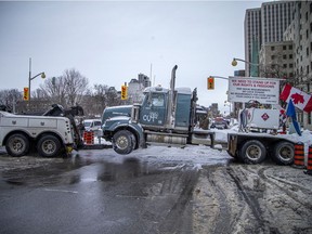 Police were still highly visible in Ottawa's downtown core, after officers pushed "Freedom Convoy" protesters out of the area on day 23 of the occupation, on Sunday, Feb. 20, 2022.
