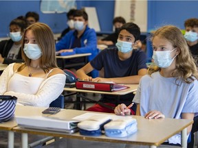 Students wear masks in Secondary 2 math class at Beaconsfield Hich School in Beaconsfield, west of Montreal Thursday September 9, 2021. After March break, students will no longer be required to wear masks while seated in class.
