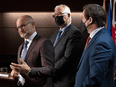 Left to right, Justice Minister David Lametti, Emergency Preparedness Minister Bill Blair and Public Safety Minister Marco Mendicino during a news conference on Wednesday, February 16, 2022 in Ottawa.